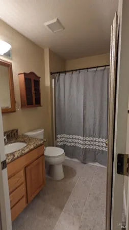a view of room with window and wooden floor