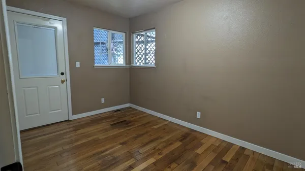 a view of backyard with a deck and wooden floor