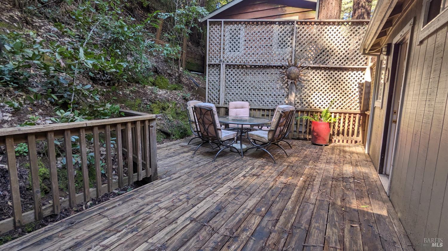 19026 Hidden Valley Road Guerneville, CA 95446 - Photo 18 of 23 a view of backyard with a deck and wooden floor