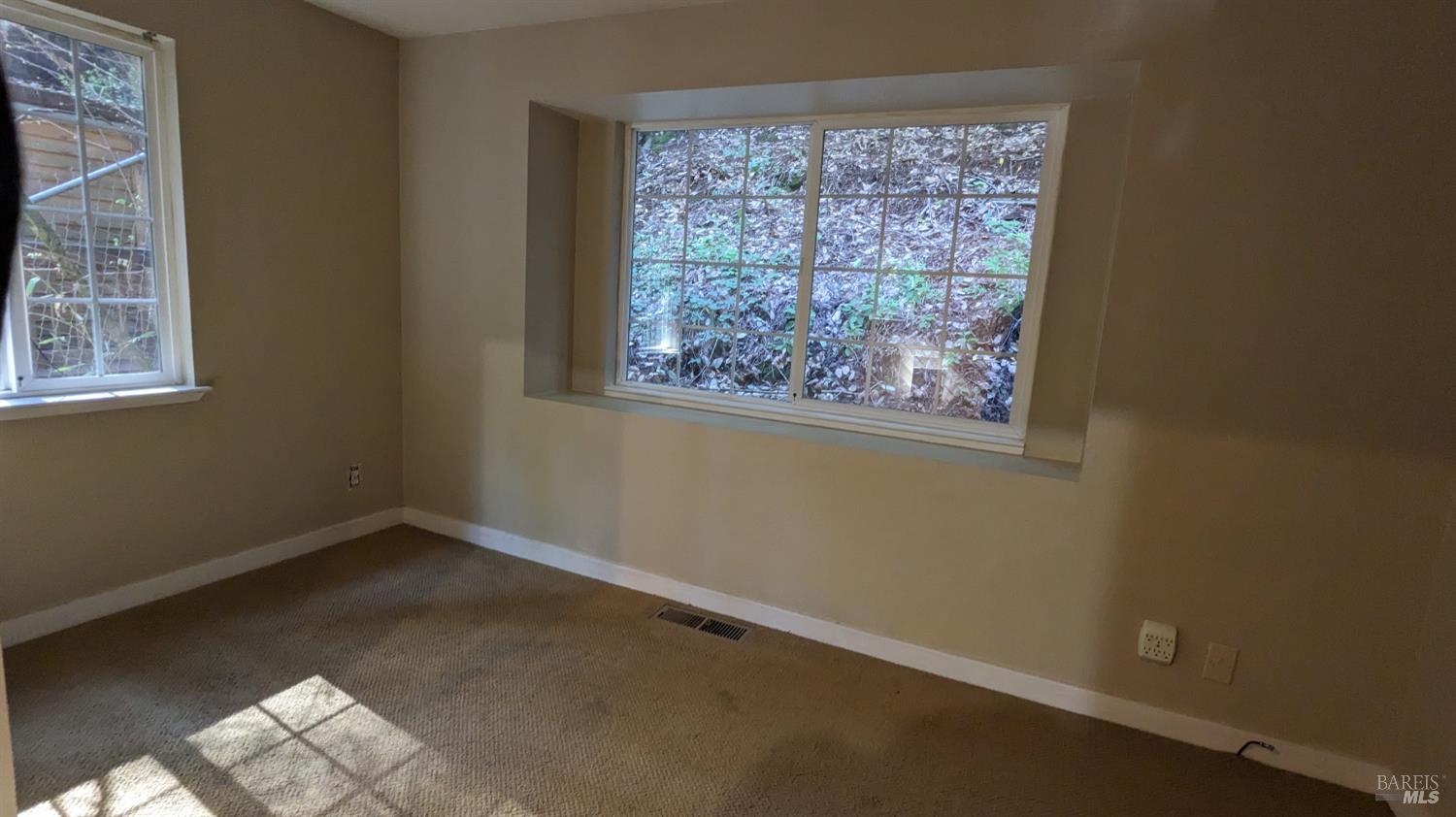 19026 Hidden Valley Road Guerneville, CA 95446 - Photo 21 of 23 an empty room with windows