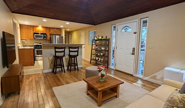a kitchen with a refrigerator and a sink