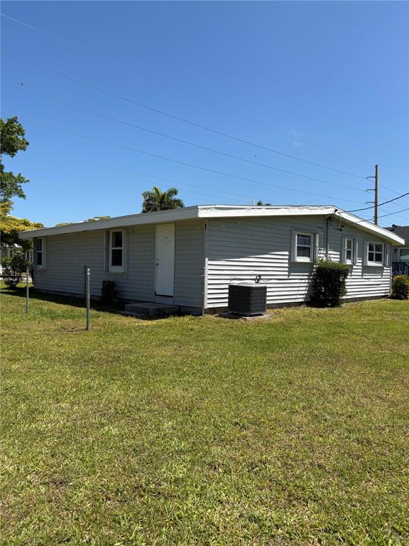 503 Myrtle Street Punta Gorda, FL 33950 - Photo 4 of 17 a front view of a house with a garden