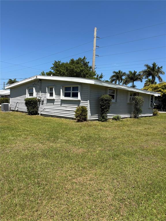 503 Myrtle Street Punta Gorda, FL 33950 - Photo 5 of 17 a front view of a house with a yard