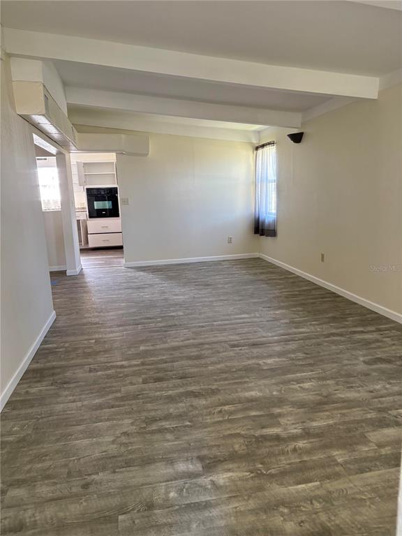 503 Myrtle Street Punta Gorda, FL 33950 - Photo 6 of 17 a view of empty room with window and wooden floor