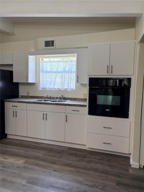503 Myrtle Street Punta Gorda, FL 33950 - Photo 8 of 17 a kitchen with granite countertop white cabinets and white appliances