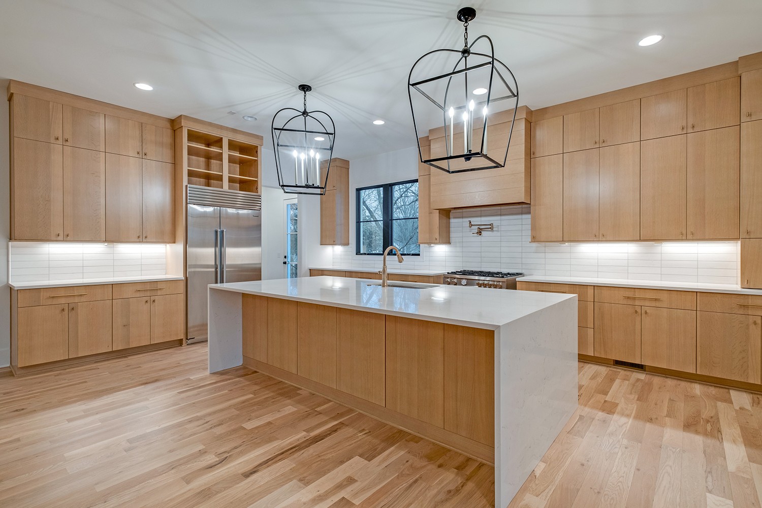 2825 Sugar Tree Road Nashville, TN 37215 - Photo 14 of 51 a kitchen with stainless steel appliances granite countertop a sink a stove and a wooden floors