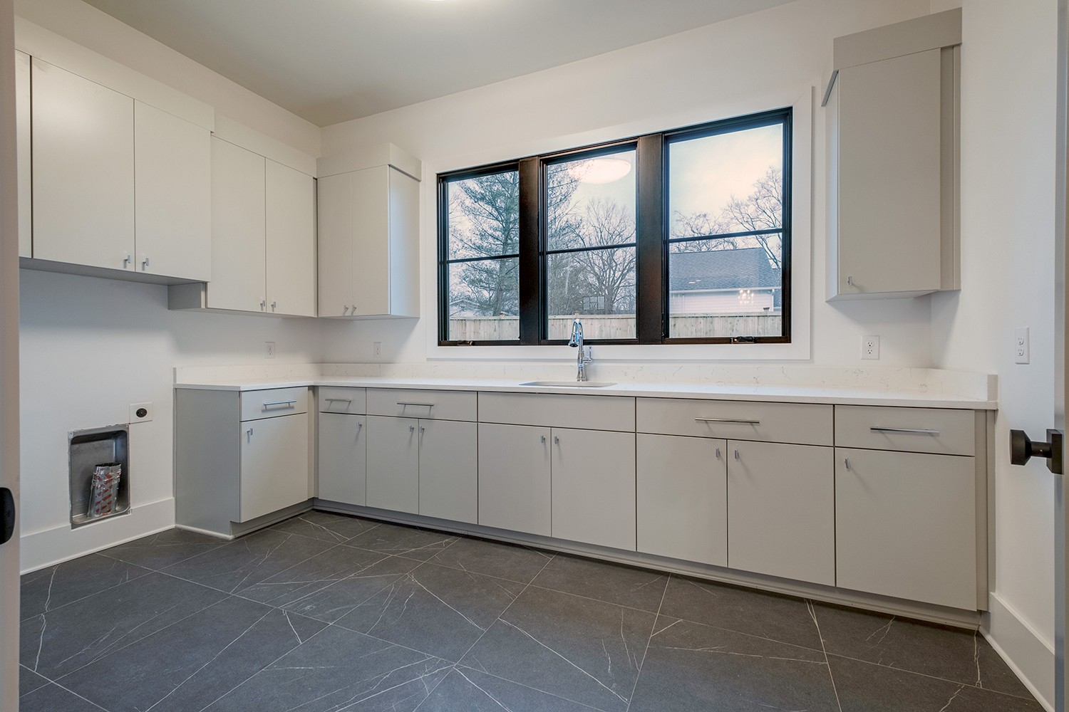 2825 Sugar Tree Road Nashville, TN 37215 - Photo 18 of 51 a kitchen with white cabinets window and sink