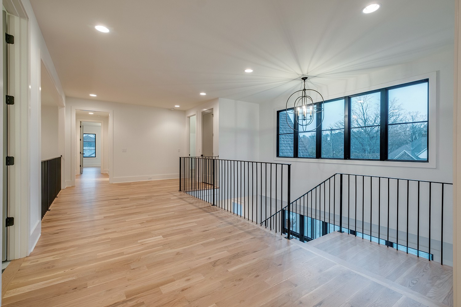 2825 Sugar Tree Road Nashville, TN 37215 - Photo 32 of 51 a view of a hallway with wooden floor and windows