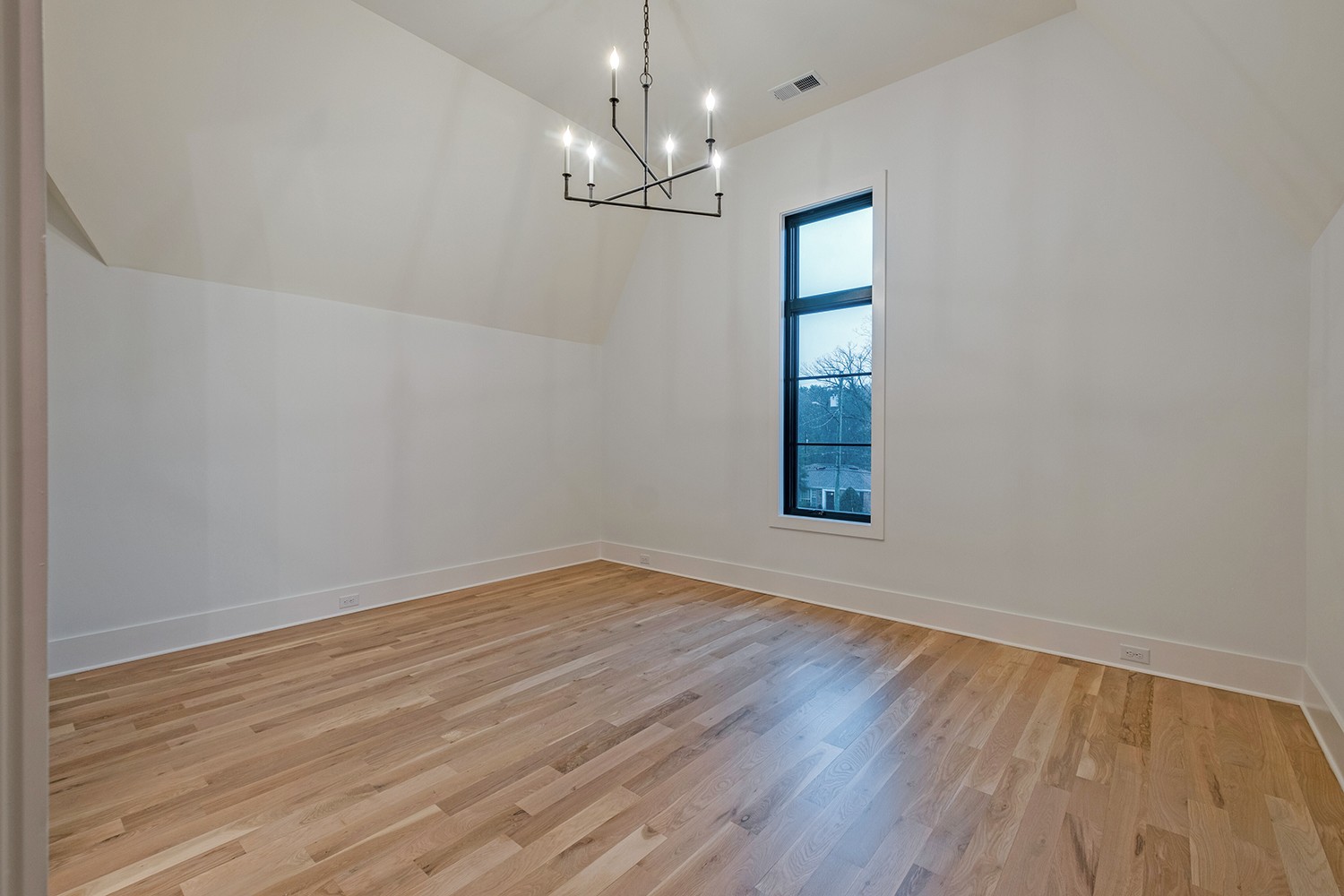 2825 Sugar Tree Road Nashville, TN 37215 - Photo 34 of 51 an empty room with wooden floor chandelier and windows