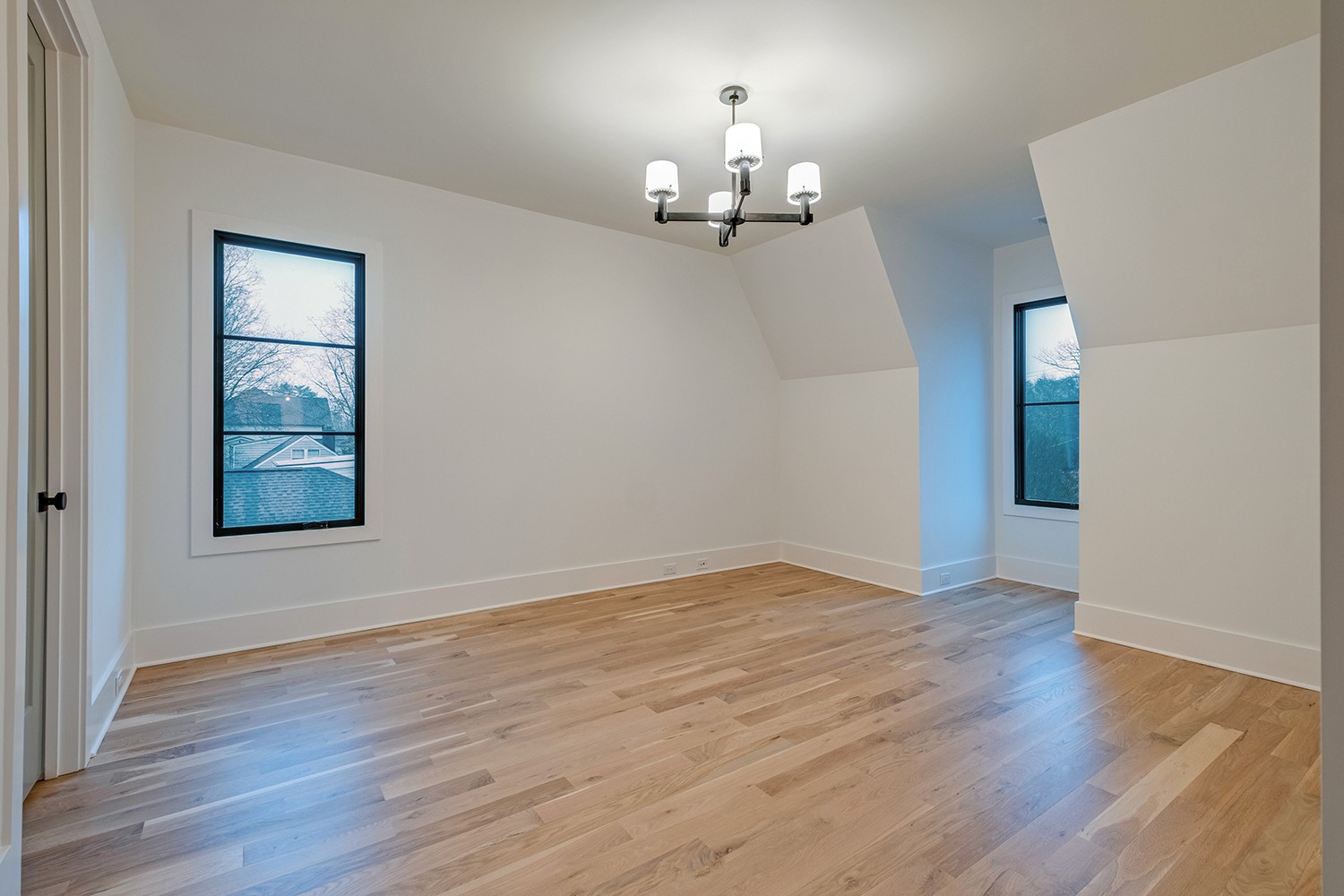 2825 Sugar Tree Road Nashville, TN 37215 - Photo 38 of 51 an empty room with wooden floor and chandelier