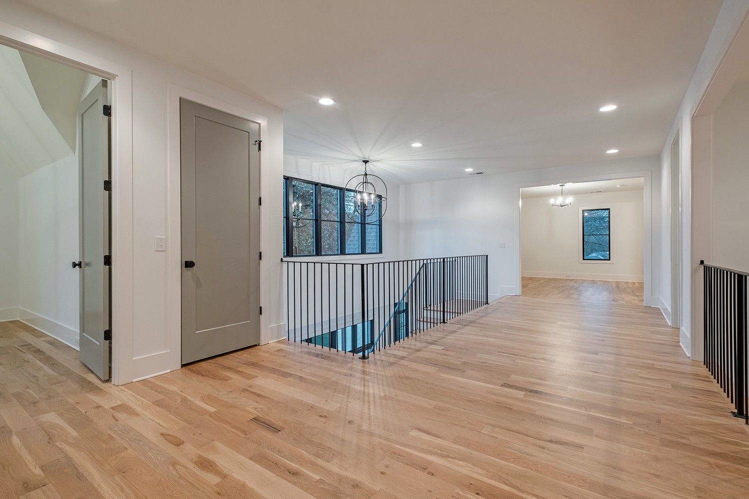 2825 Sugar Tree Road Nashville, TN 37215 - Photo 42 of 51 a view of a hallway with wooden floor and staircase