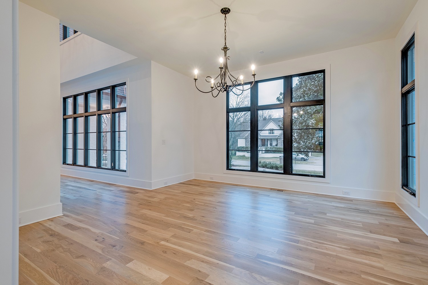 2825 Sugar Tree Road Nashville, TN 37215 - Photo 8 of 51 a view of an empty room with wooden floor and a window