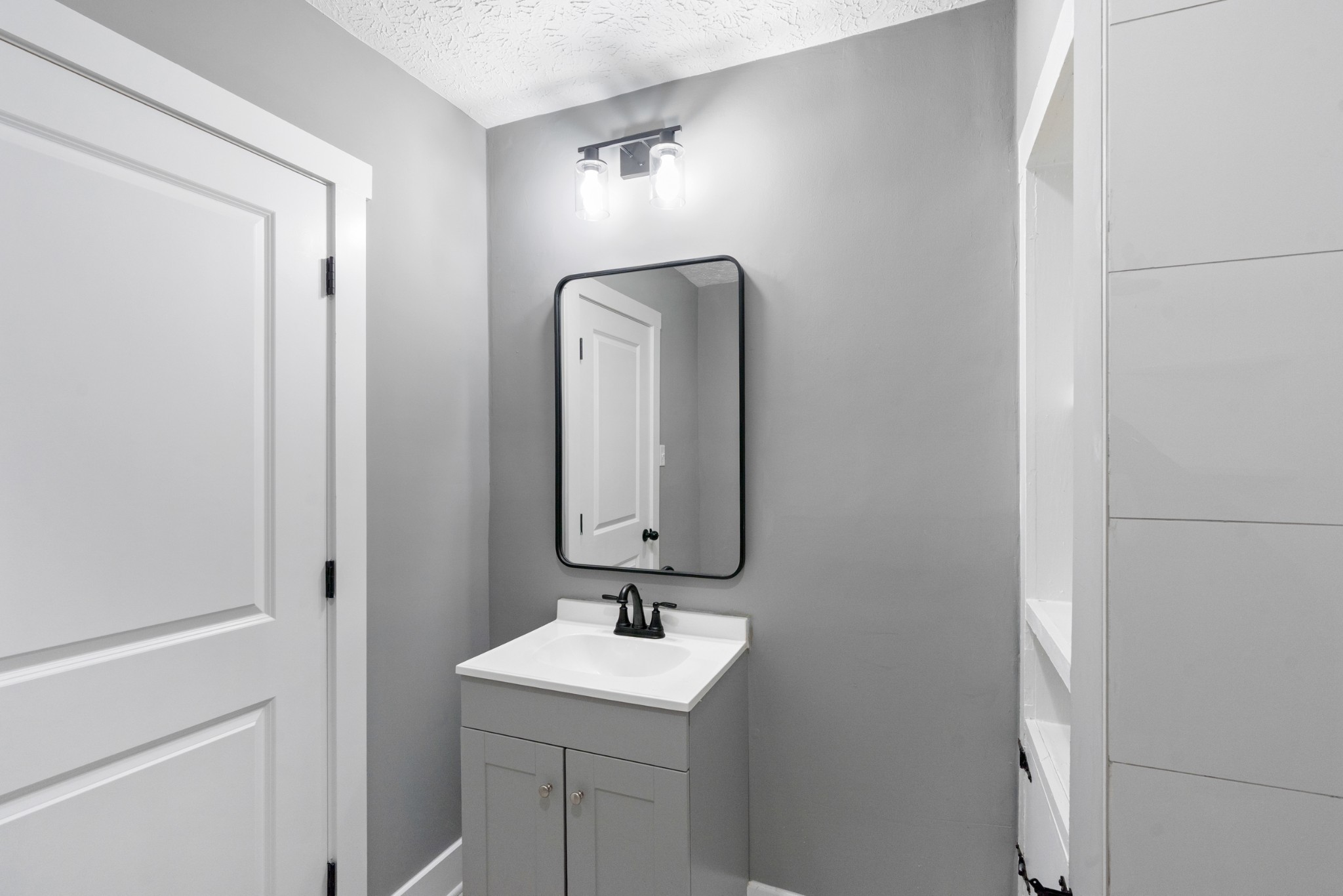 1503 5th Avenue West Springfield, TN 37172 - Photo 15 of 43 a bathroom with a sink and a mirror
