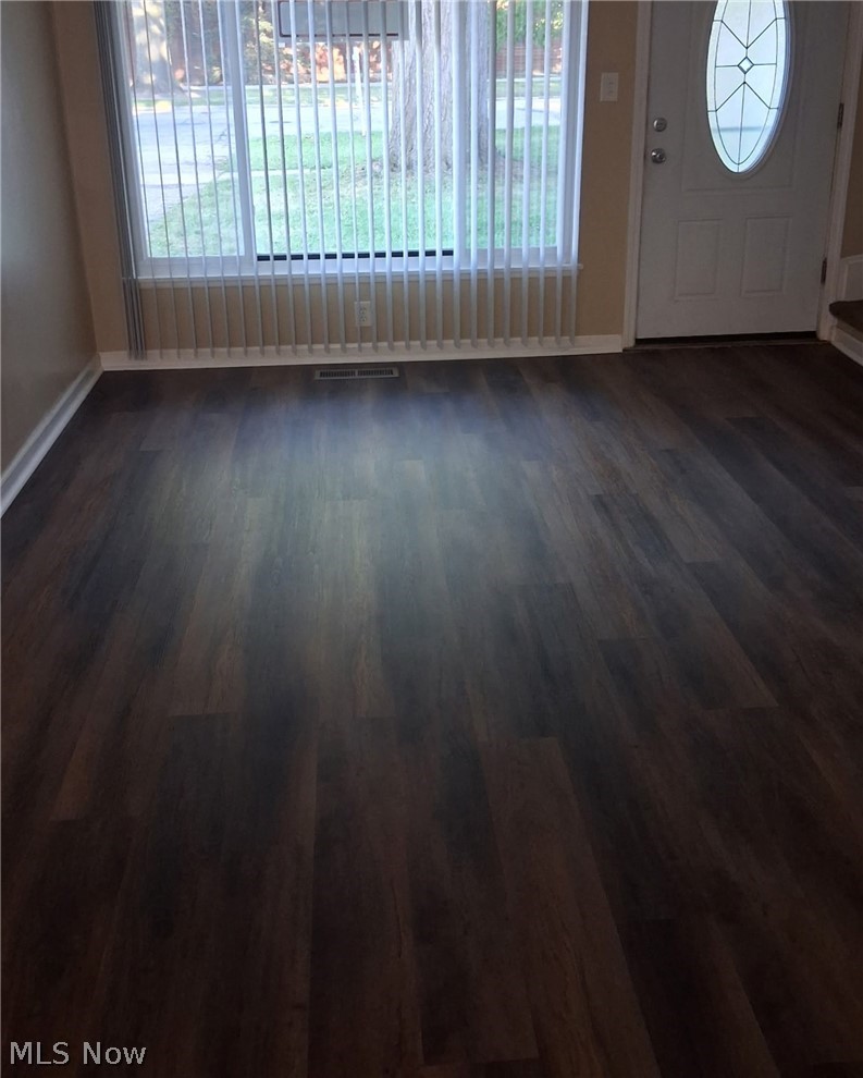 Brand new flooring installed on main level living room and dining room areas. Front window has brand new blinds.