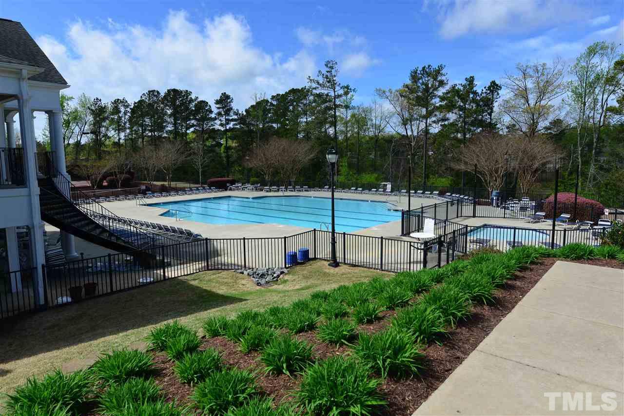 7228 Janston Drive Raleigh, NC 27613 - Photo 3 of 8 a view of a swimming pool with chairs and plants