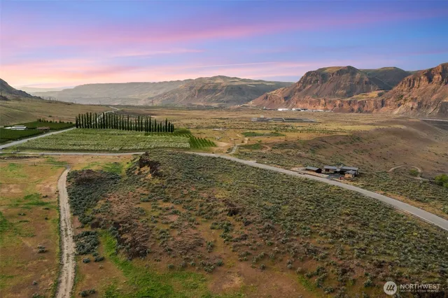 a view of a town with mountains in the background