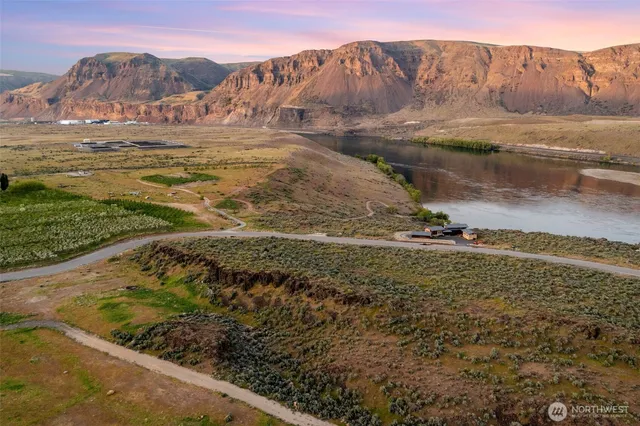 a view of a backyard with wooden floor and a mountain view