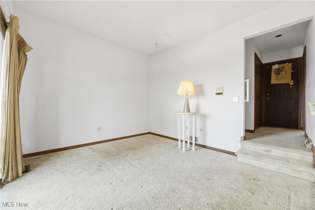 7014 River Styx Road Medina, OH 44256 - Photo 17 of 49 Empty room with light colored carpet and baseboards