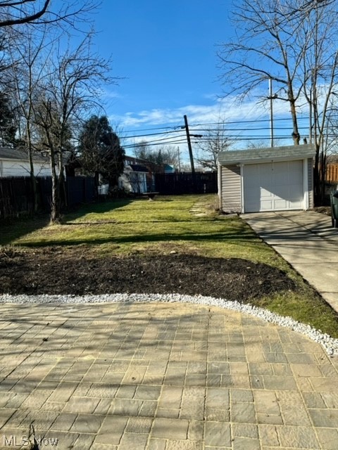 1508 Winchester Road Lyndhurst, OH 44124 - Photo 22 of 23 View of yard with an outdoor structure and a garage