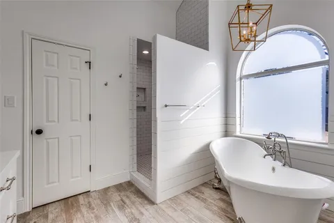 a bathroom with a sink a mirror and a shower