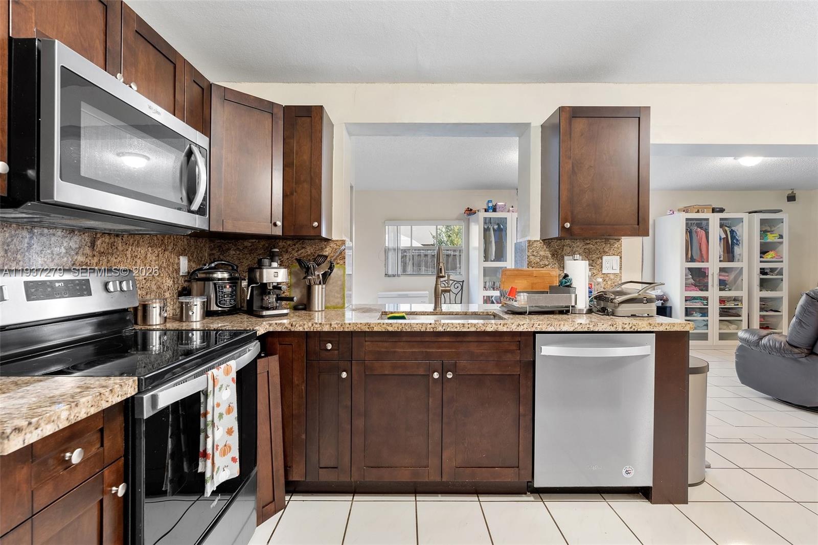 14256 Southwest 92nd Street Miami, FL 33176 - Photo 15 of 56 a kitchen with lots of counter top space