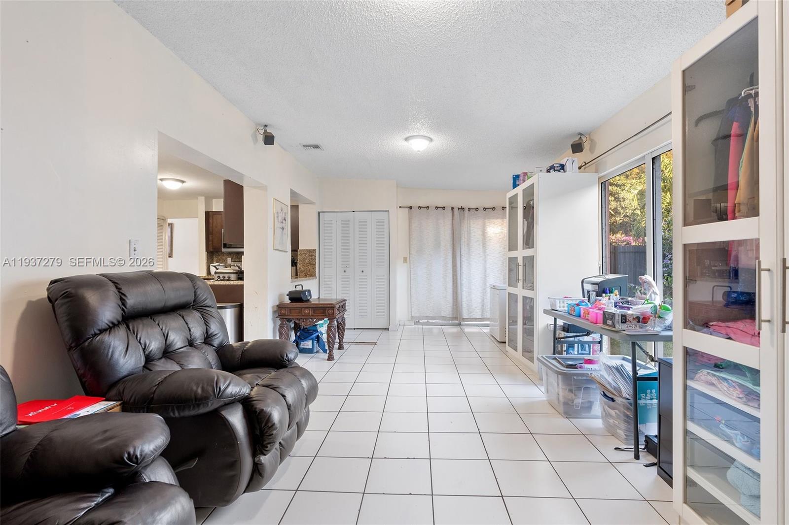 14256 Southwest 92nd Street Miami, FL 33176 - Photo 22 of 56 a living room with furniture and a couch