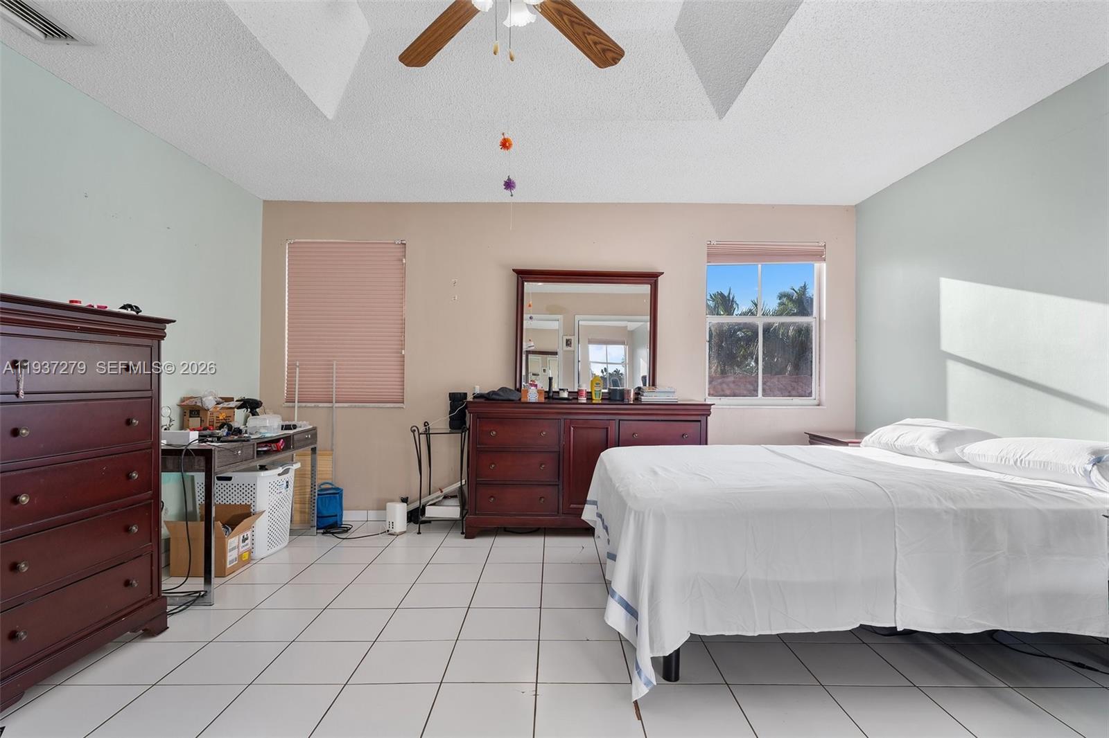 14256 Southwest 92nd Street Miami, FL 33176 - Photo 26 of 56 a bed room with a bed and a window