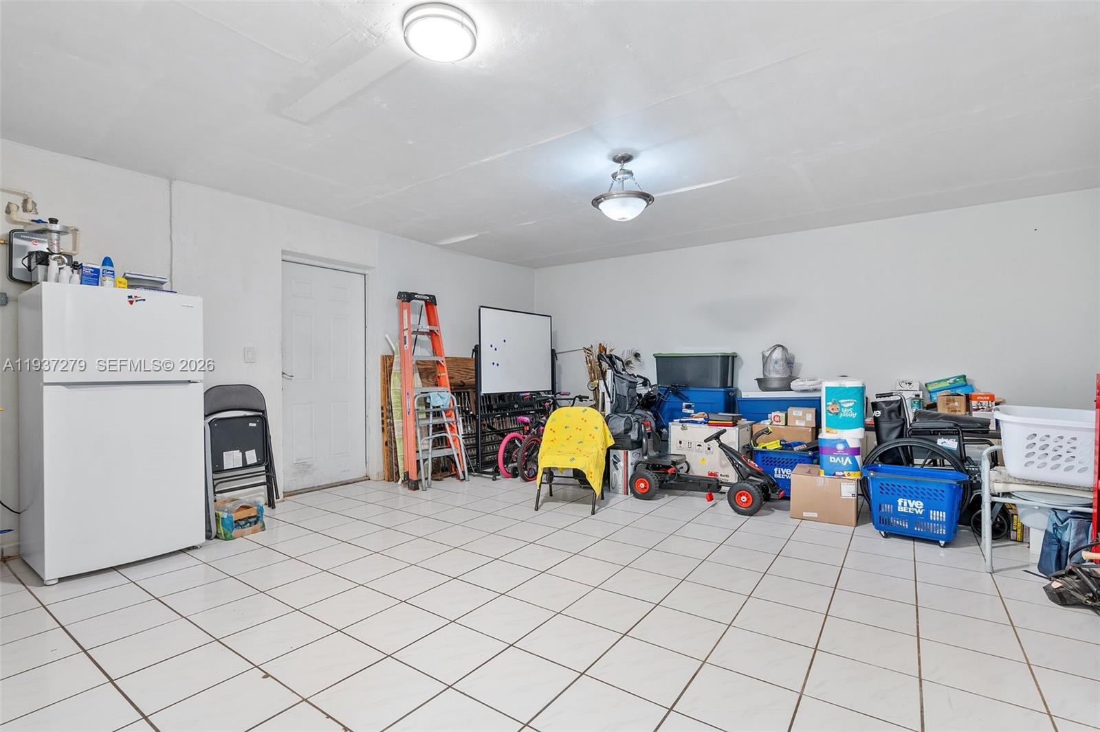 14256 Southwest 92nd Street Miami, FL 33176 - Photo 38 of 56 a view of a storage & utility room with toys