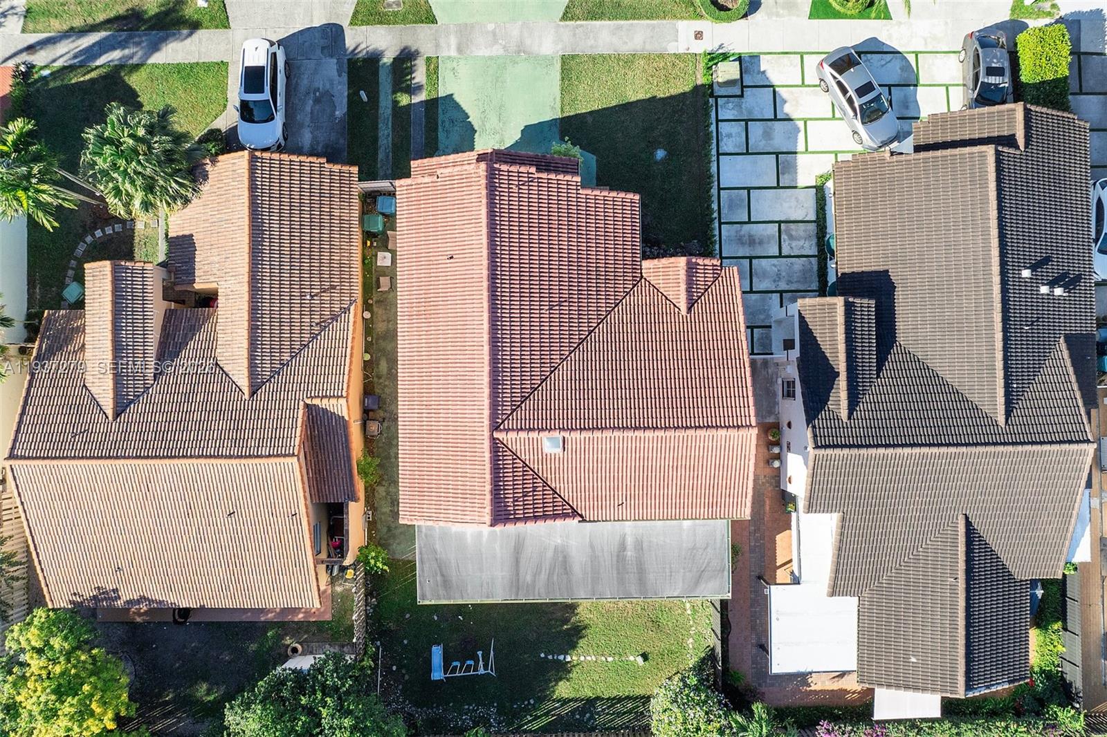 14256 Southwest 92nd Street Miami, FL 33176 - Photo 42 of 56 an aerial view of a house with yard and parking