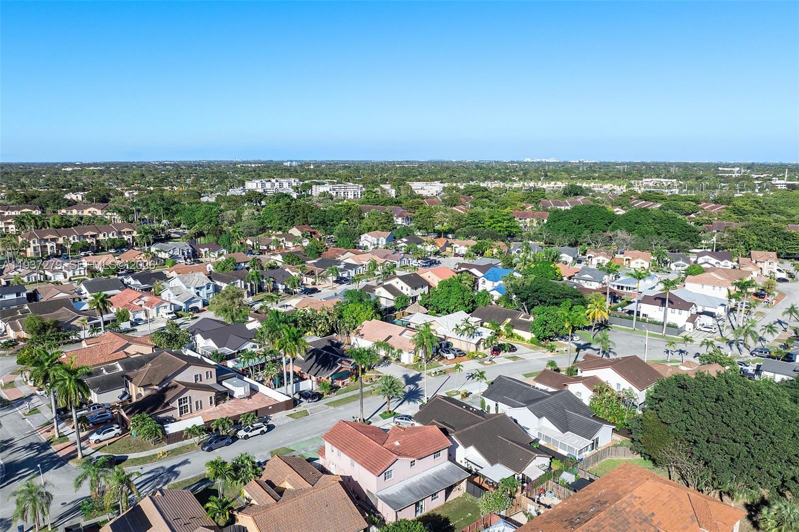 14256 Southwest 92nd Street Miami, FL 33176 - Photo 46 of 56 an aerial view of residential houses with outdoor space