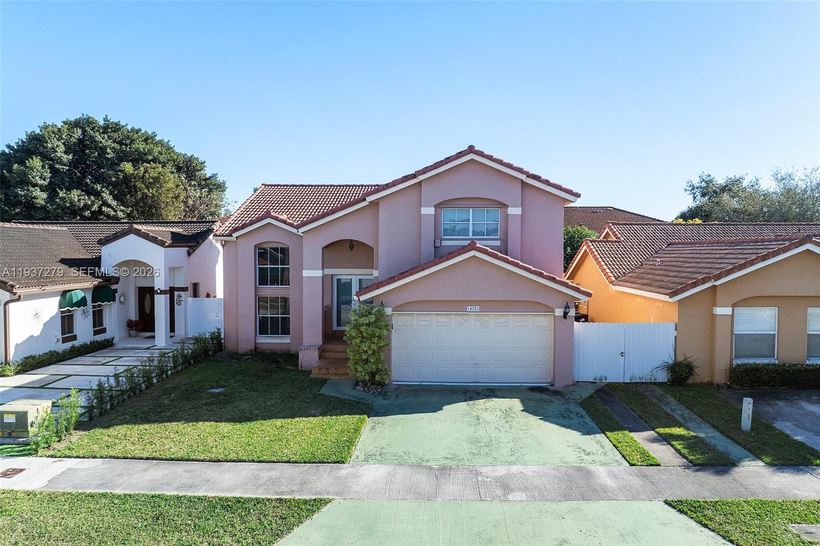 14256 Southwest 92nd Street Miami, FL 33176 - Photo 53 of 56 front view of a house with a yard