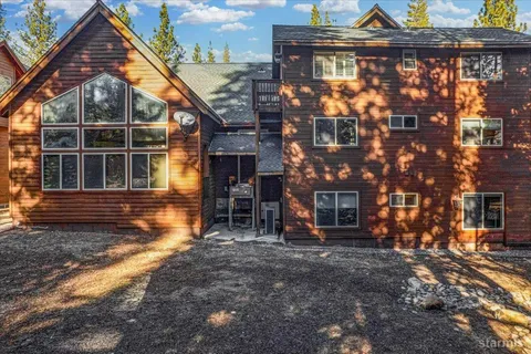 an aerial view of house with yard