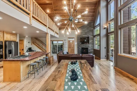 a kitchen with stainless steel appliances kitchen island granite countertop a sink and cabinets