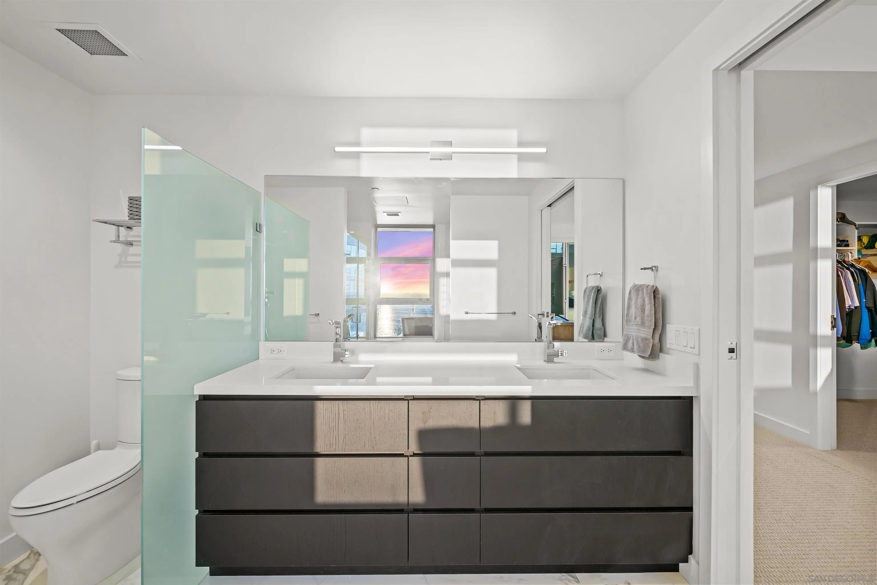 1388 Kettner Boulevard, Unit 3205 San Diego, CA 92101 - Photo 25 of 53 a bathroom with a sink vanity granite and a mirror