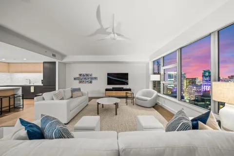 a living room with furniture or outdoor view and a large window