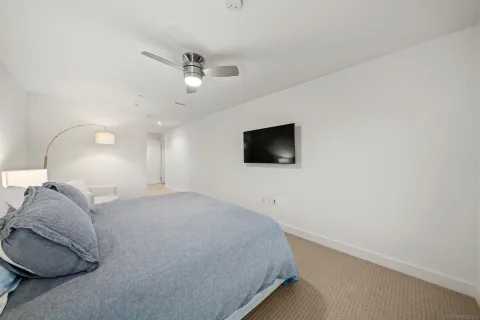 a bathroom with a double vanity sink mirror and toilet