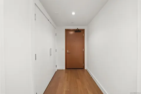 a bathroom with a granite countertop sink a toilet and a mirror