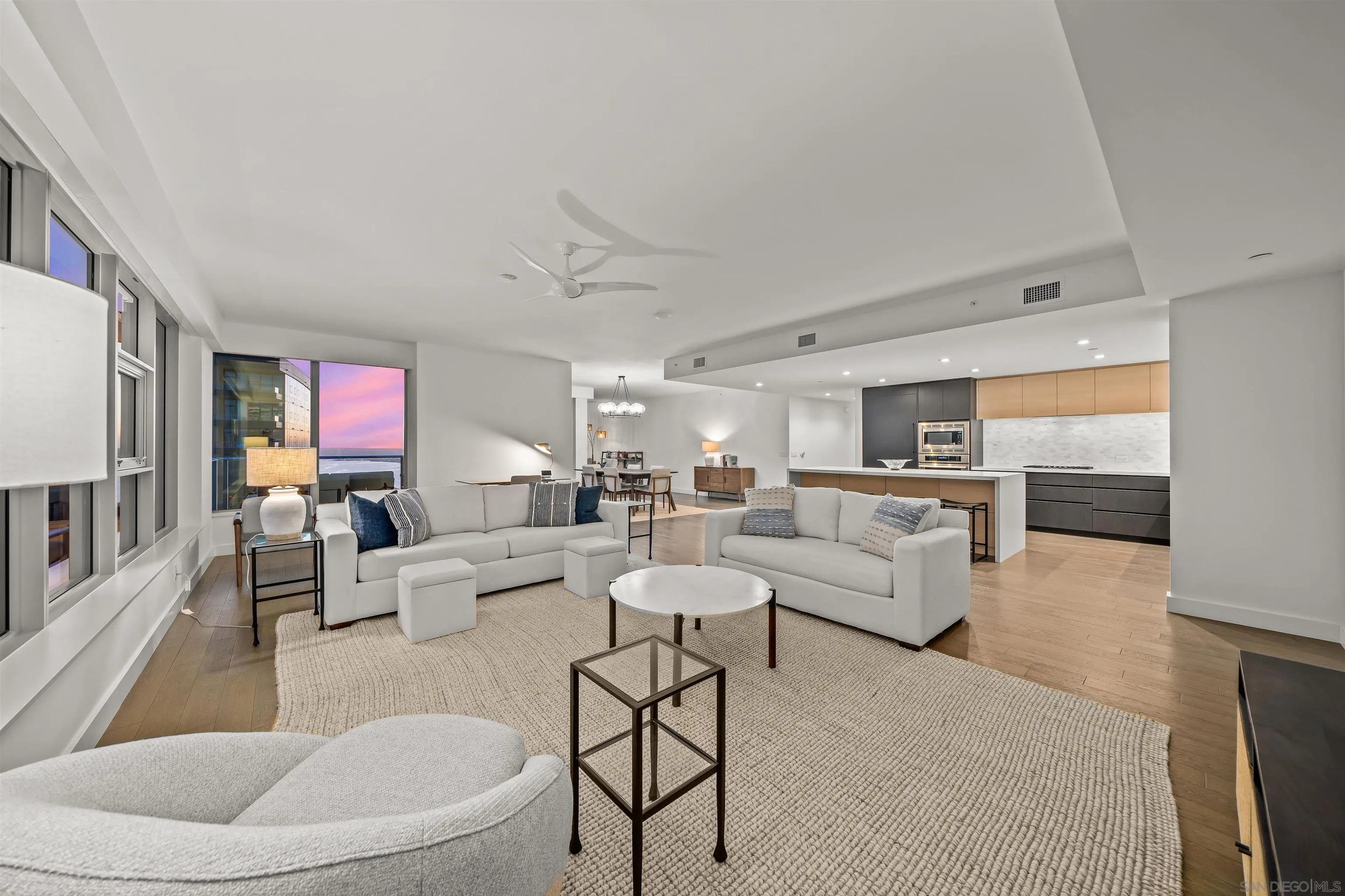 1388 Kettner Boulevard, Unit 3205 San Diego, CA 92101 - Photo 4 of 53 a living room with furniture and a flat screen tv