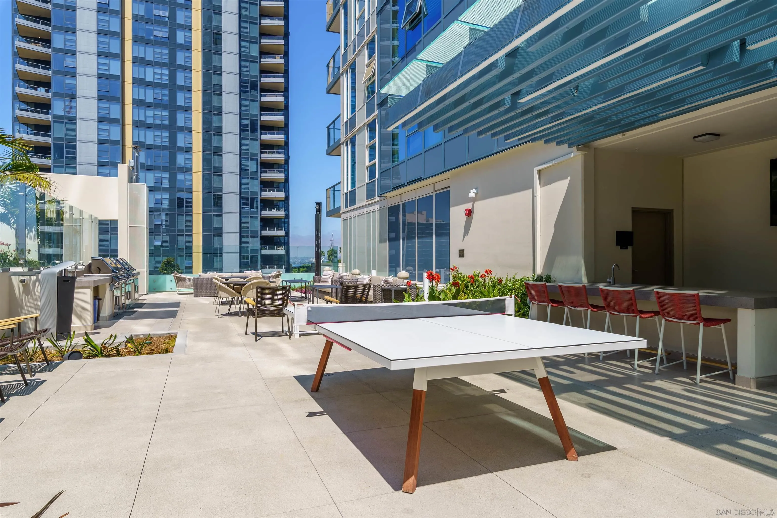 1388 Kettner Boulevard, Unit 3205 San Diego, CA 92101 - Photo 45 of 53 a view of a patio with a table and chairs