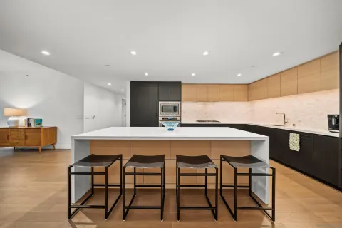 a kitchen with a table and chairs in it