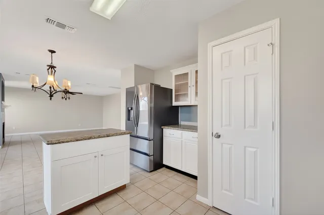 a bathroom with a sink double vanity granite and a mirror