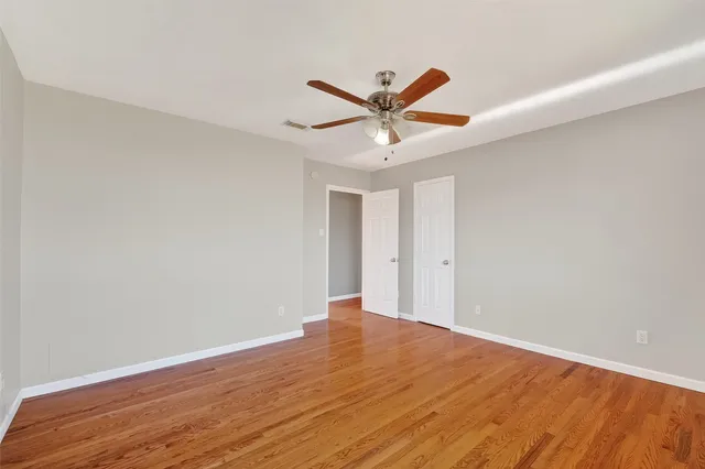 a bathroom with a sink mirror vanity and toilet