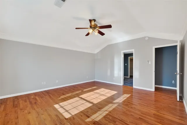 a white bath tub sitting next to a shower