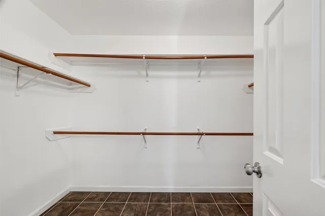 a view of yard with large trees