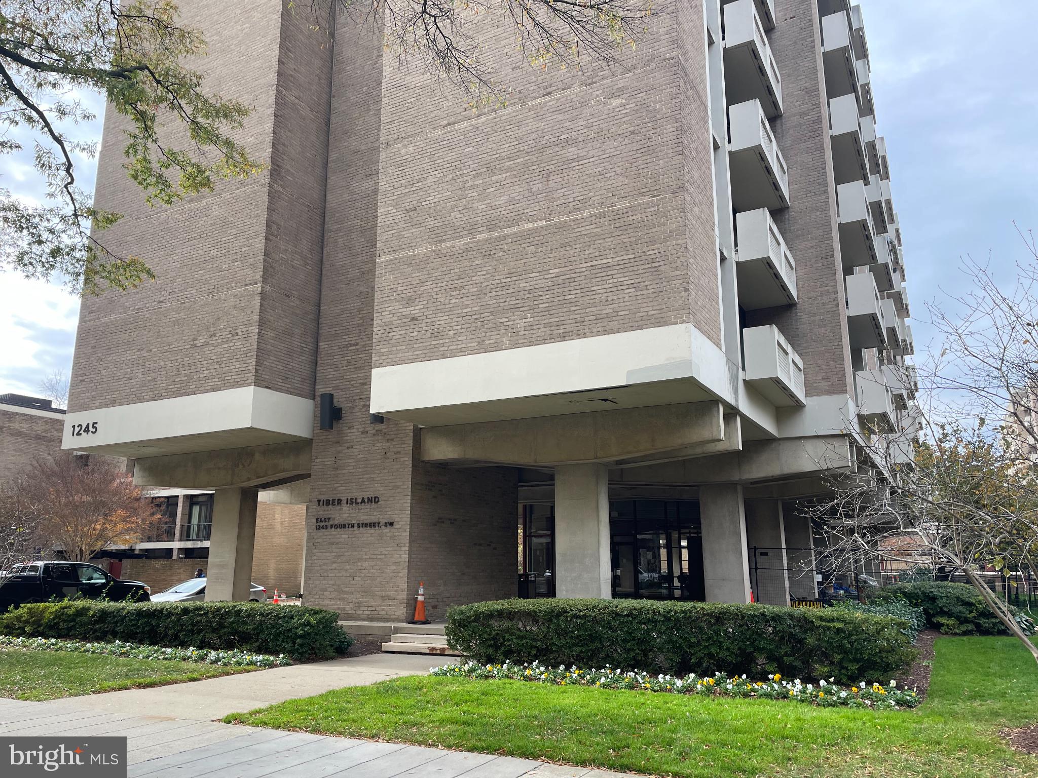 front view of a building with a yard