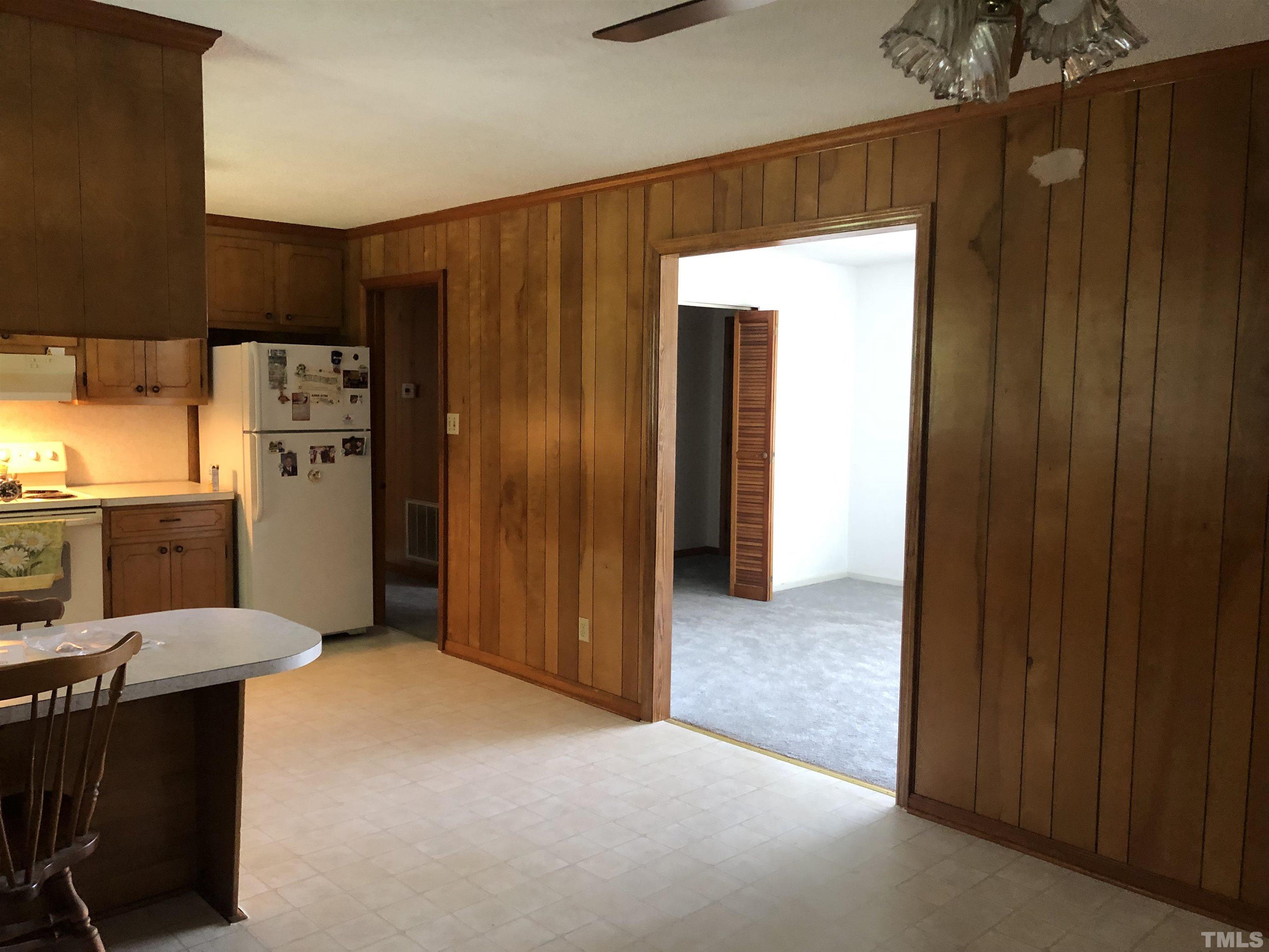 927 Junction Road Durham, NC 27704 - Photo 22 of 22 a view of a kitchen with refrigerator and table