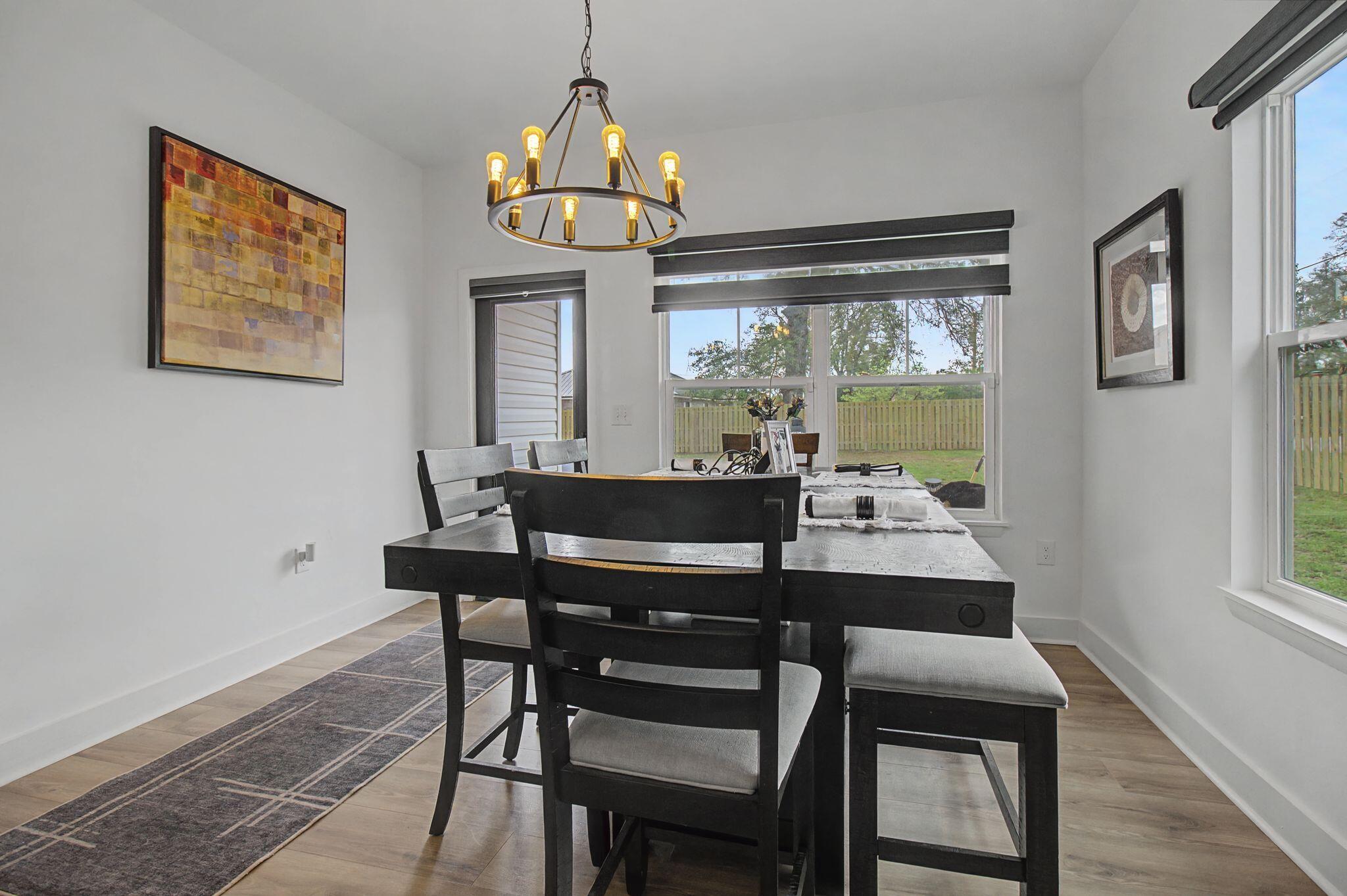 197 West 1st Avenue Crestview, FL 32536 - Photo 14 of 32 a view of a dining room with furniture window and outside view