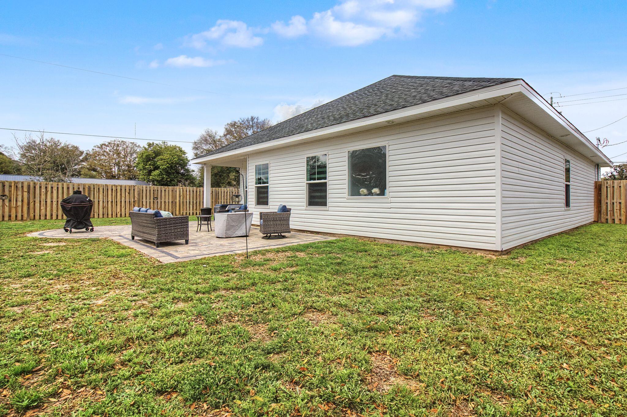 197 West 1st Avenue Crestview, FL 32536 - Photo 28 of 32 a view of a house with backyard and sitting area