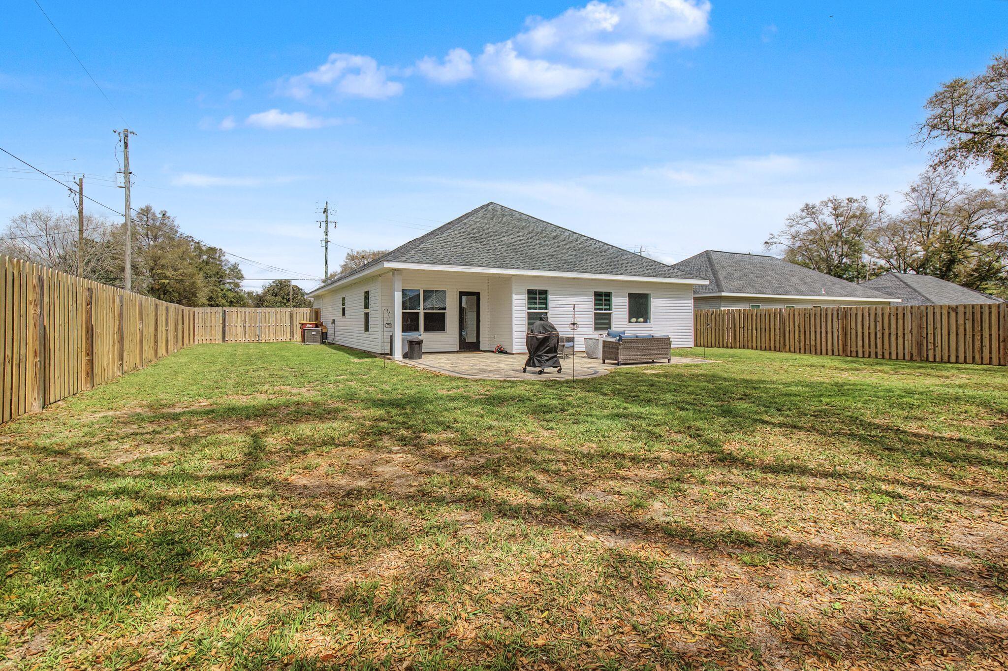 197 West 1st Avenue Crestview, FL 32536 - Photo 31 of 32 a front view of a house with a yard