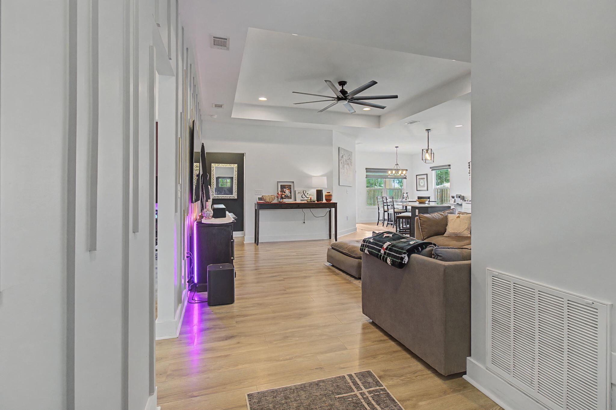 197 West 1st Avenue Crestview, FL 32536 - Photo 4 of 32 a living room with furniture and a flat screen tv